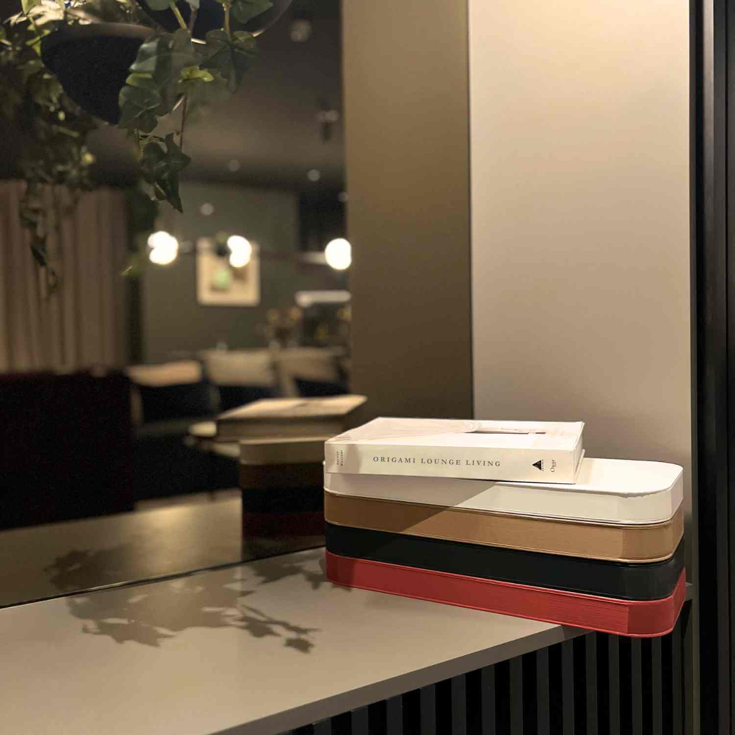 4 folded stools book size space saving white red black brown